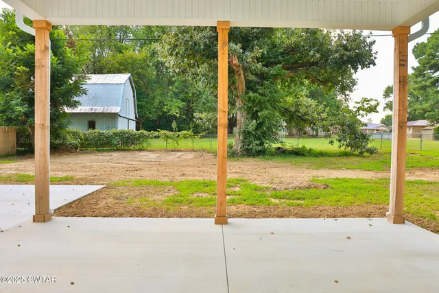 a view of a street with a park