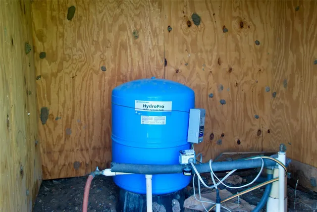 a view of a room with a table and chairs