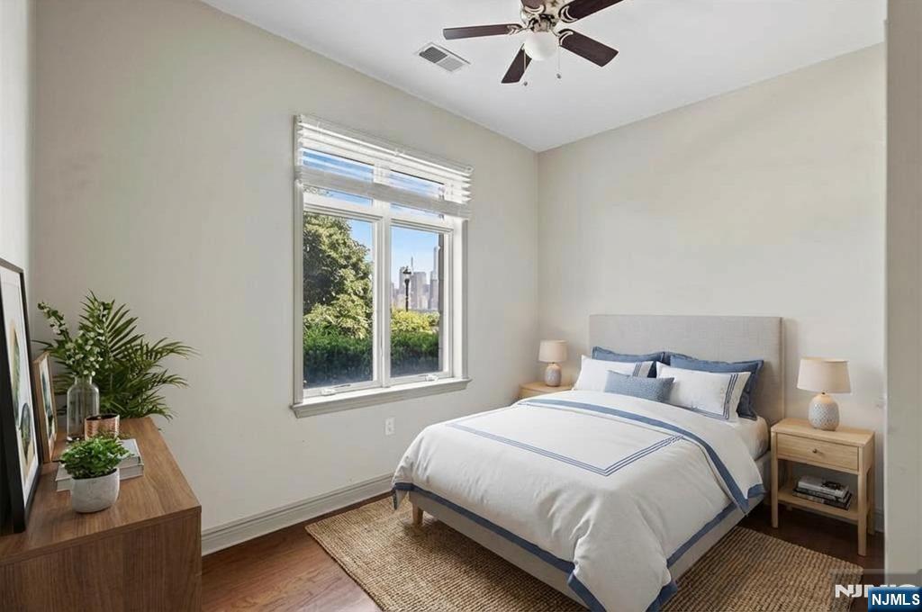 7400 River Road, Unit 116 North Bergen, NJ 07047 - Photo 13 of 32 a bedroom with a bed and a potted plant