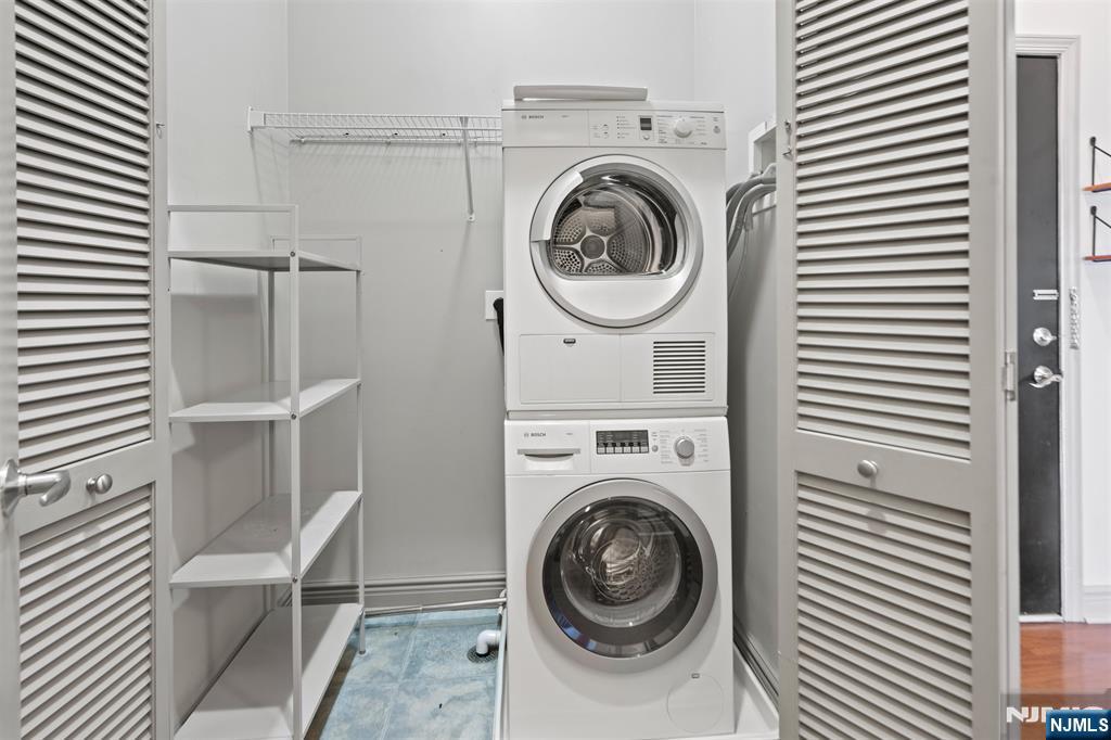 7400 River Road, Unit 116 North Bergen, NJ 07047 - Photo 16 of 32 a view of a hallway with washer and dryer