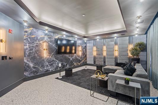 7400 River Road, Unit 116 North Bergen, NJ 07047 - Photo 21 of 32 a living room with furniture and a floor to ceiling window