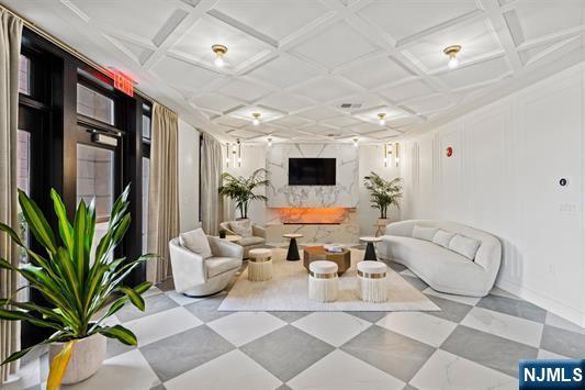 7400 River Road, Unit 116 North Bergen, NJ 07047 - Photo 23 of 32 a living room with patio furniture and a potted plant