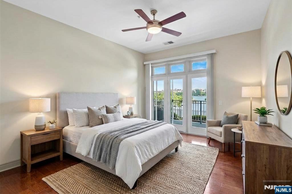 7400 River Road, Unit 116 North Bergen, NJ 07047 - Photo 4 of 32 a bedroom with a large bed and a window