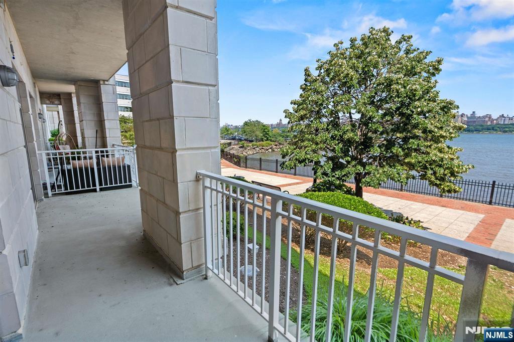 7400 River Road, Unit 116 North Bergen, NJ 07047 - Photo 5 of 32 a view of a building from a balcony