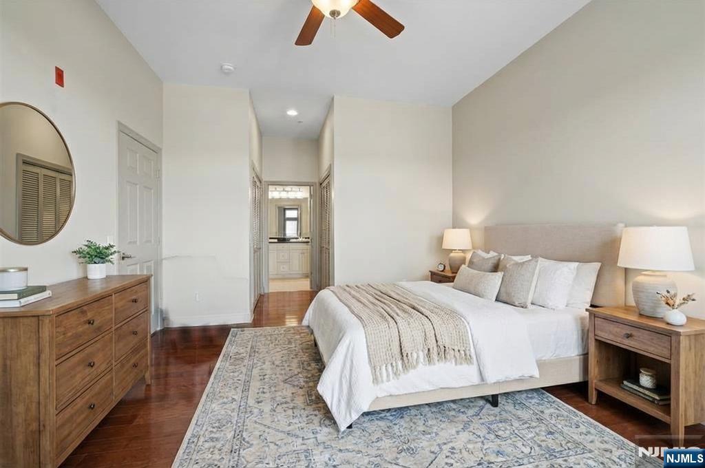 7400 River Road, Unit 116 North Bergen, NJ 07047 - Photo 7 of 32 a bedroom with a bed and a dresser