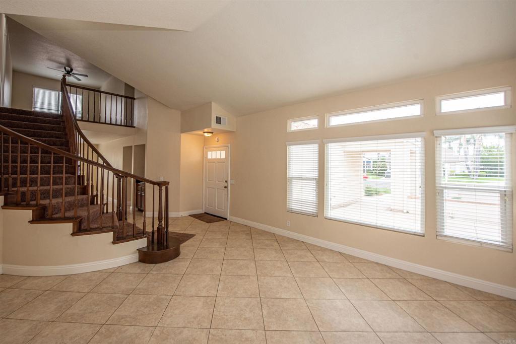 28679 Corte Capri Menifee, CA 92584 - Photo 12 of 66 a view of an entryway with wooden floor and a window