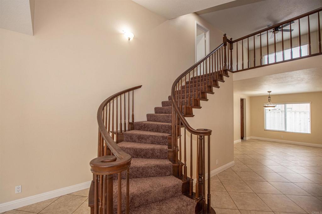 28679 Corte Capri Menifee, CA 92584 - Photo 14 of 66 a view of entryway and hall with wooden floor