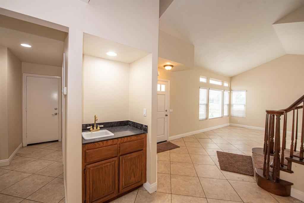 28679 Corte Capri Menifee, CA 92584 - Photo 16 of 66 a kitchen with granite countertop a sink and a stove