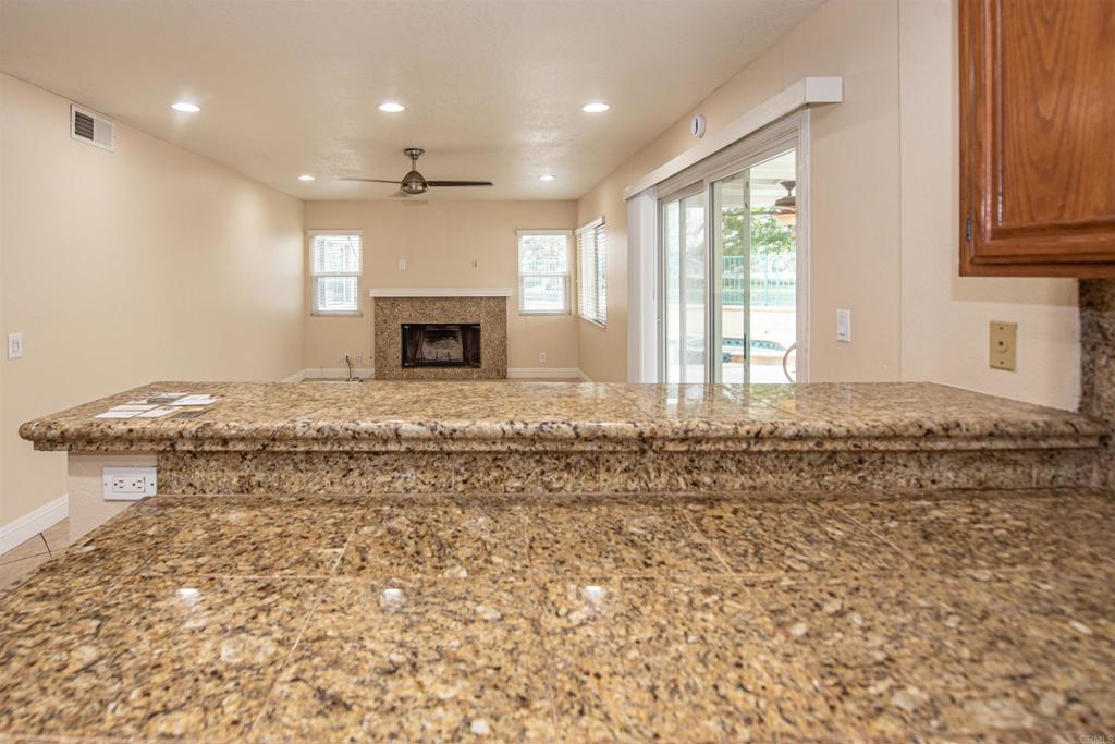 28679 Corte Capri Menifee, CA 92584 - Photo 27 of 66 a view of a kitchen with a fireplace and a window