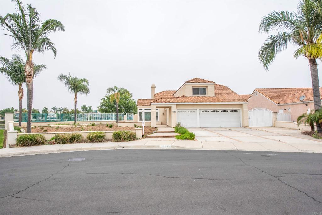 28679 Corte Capri Menifee, CA 92584 - Photo 4 of 66 a front view of a house with a yard and palm trees