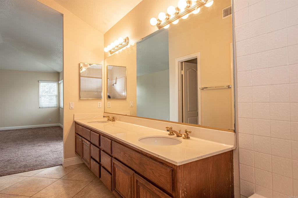 28679 Corte Capri Menifee, CA 92584 - Photo 45 of 66 a bathroom with a sink and a mirror