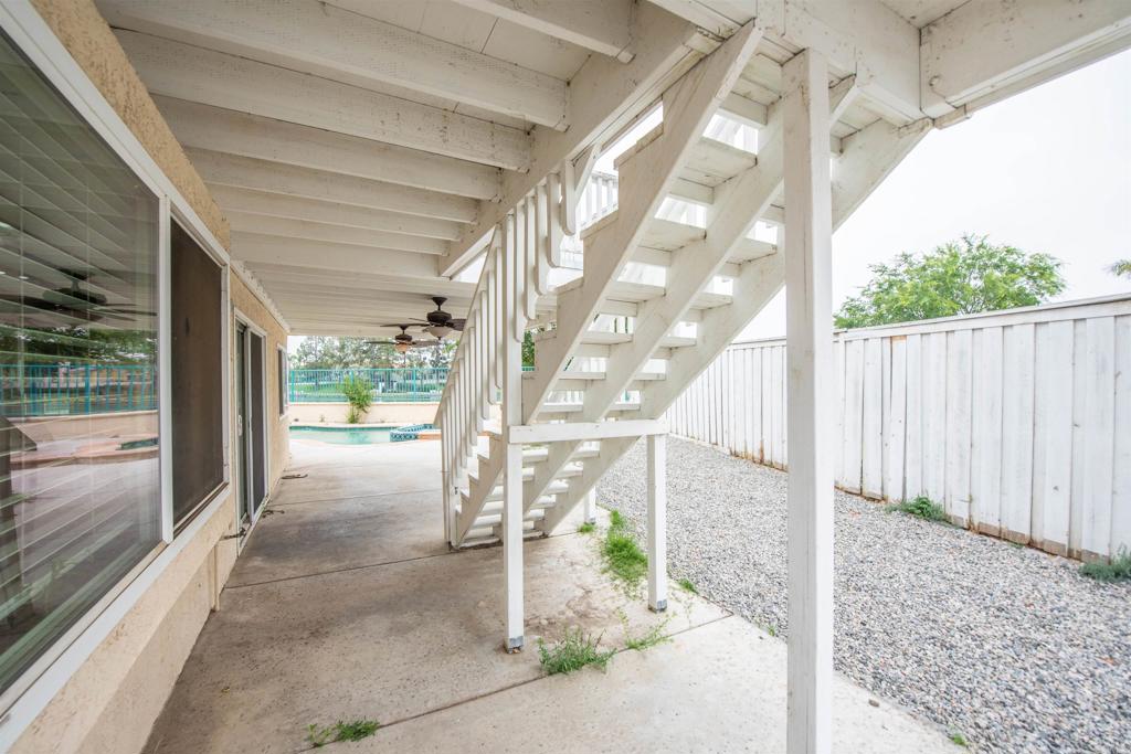 28679 Corte Capri Menifee, CA 92584 - Photo 61 of 66 a porch with a bench in front of it