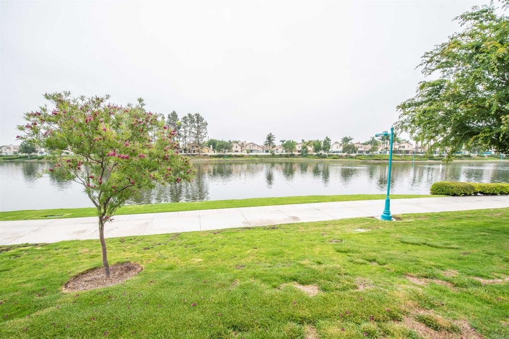 28679 Corte Capri Menifee, CA 92584 - Photo 65 of 66 a view of a lake with houses in the background