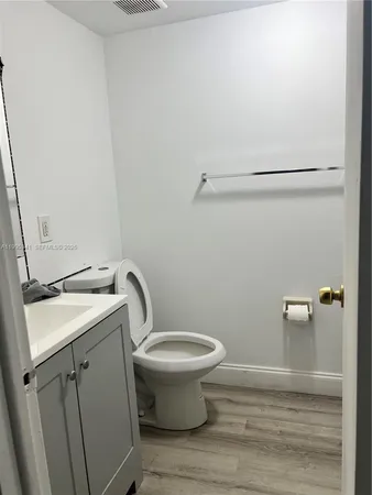 a bathroom with a sink and toilet