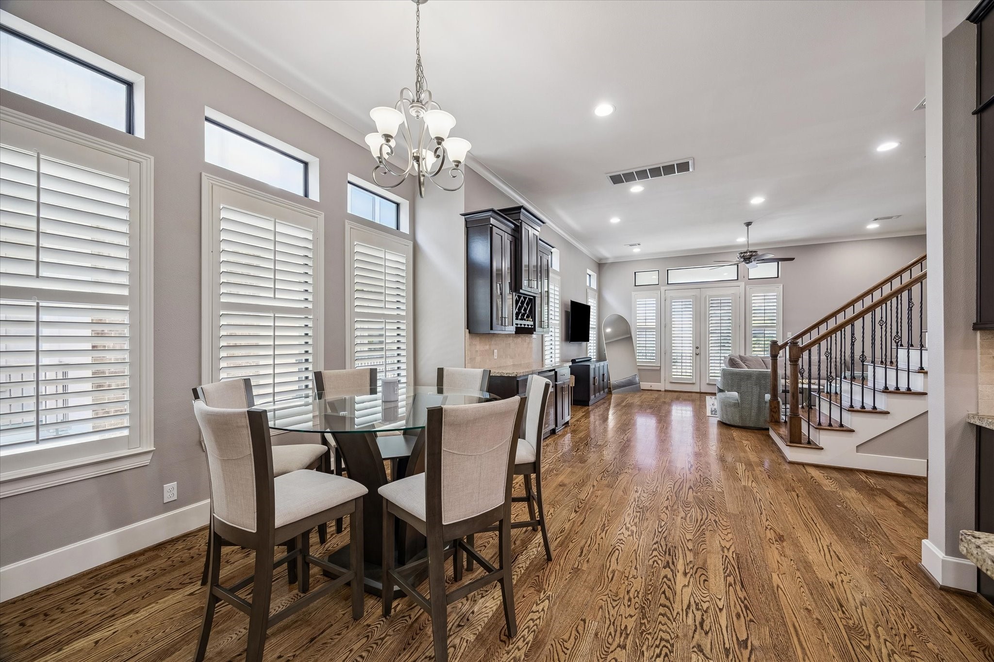 3123 Austin Street Houston, TX 77004 - Photo 11 of 24 a view of a dining room with furniture a chandelier and wooden floor