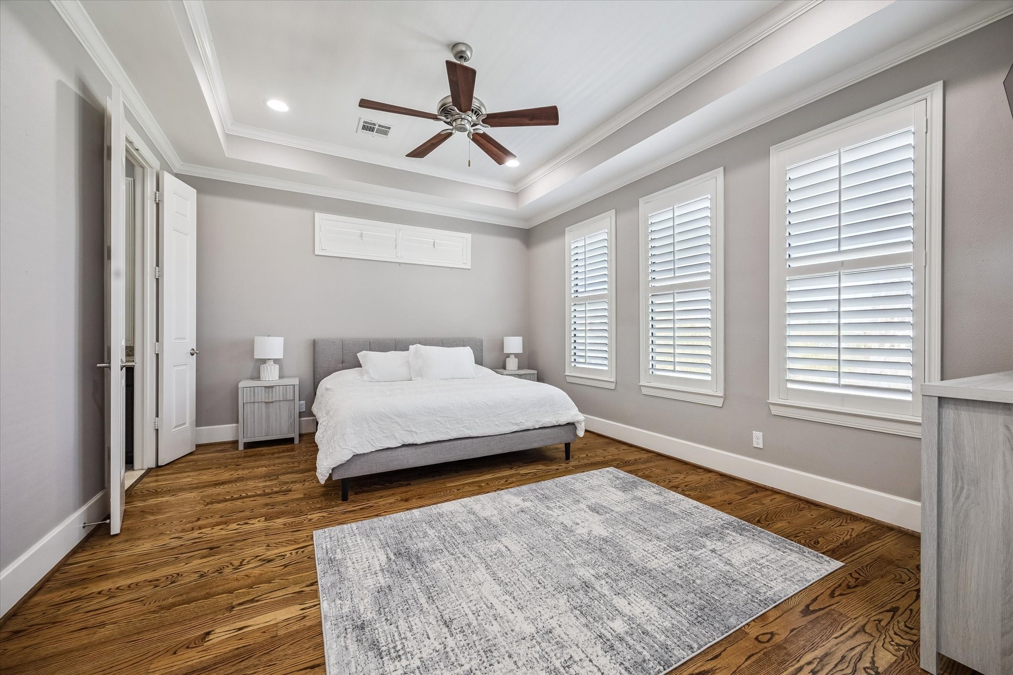 3123 Austin Street Houston, TX 77004 - Photo 15 of 24 a spacious bedroom with a bed dresser and a window