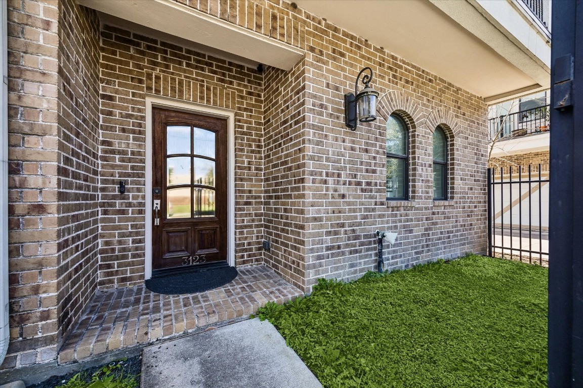 3123 Austin Street Houston, TX 77004 - Photo 2 of 24 a brick house with a yard