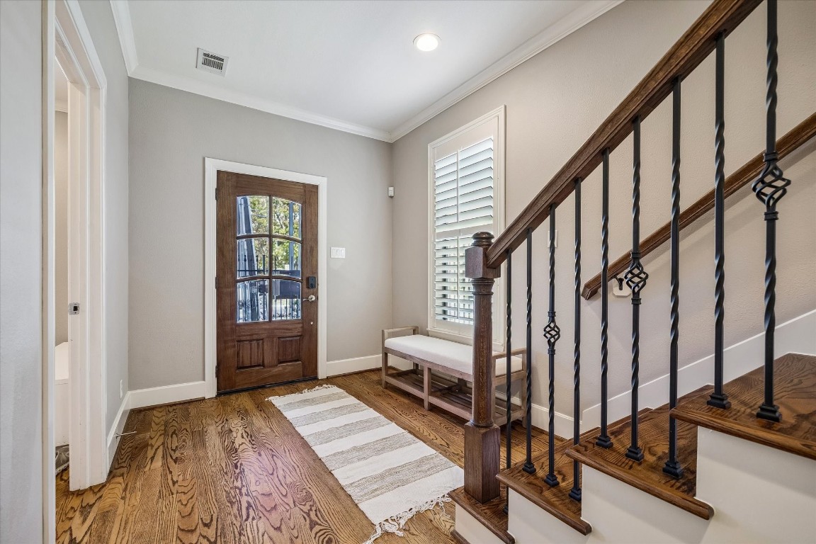 3123 Austin Street Houston, TX 77004 - Photo 3 of 24 a view of an entryway with wooden floor and windows