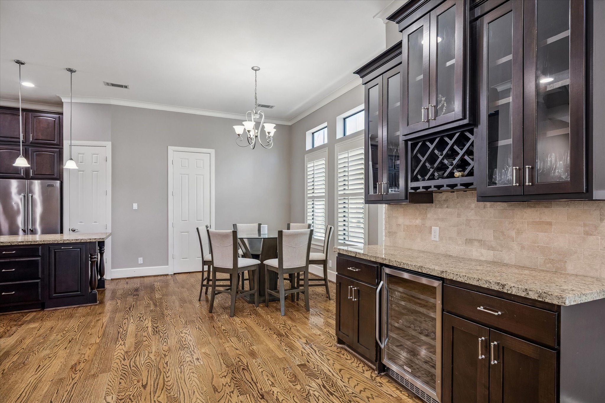 3123 Austin Street Houston, TX 77004 - Photo 10 of 24 a kitchen with stainless steel appliances granite countertop a sink dishwasher a stove and a refrigerator with wooden floor