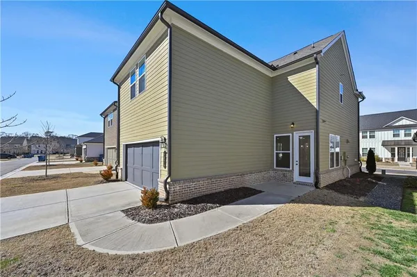 a front view of a house with garage