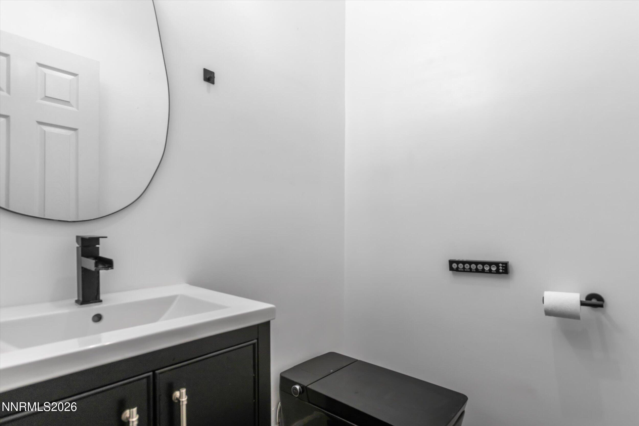 5850 Geode Court Reno, NV 89523 - Photo 24 of 88 a bathroom with a sink and a mirror