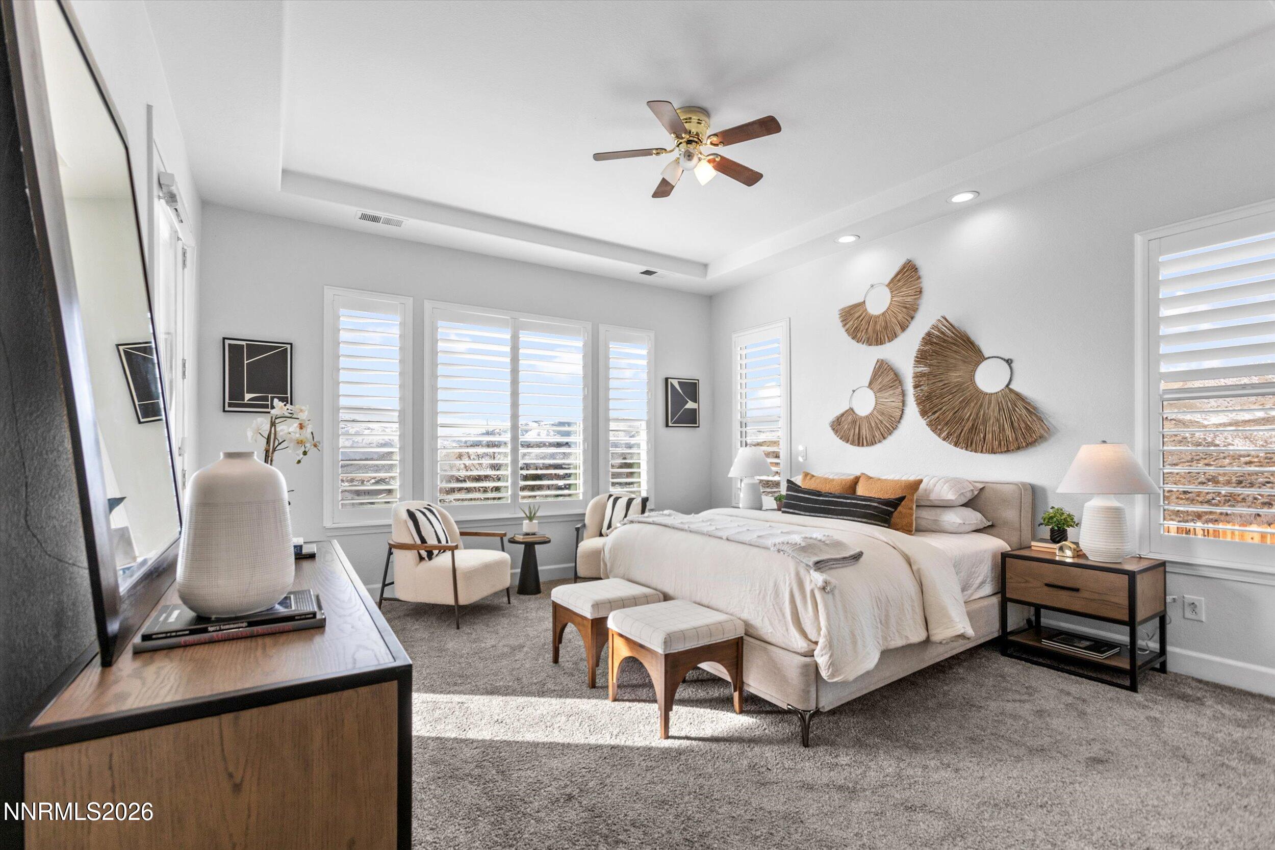 5850 Geode Court Reno, NV 89523 - Photo 27 of 88 a bedroom with a bed a large window and potted plant on a table
