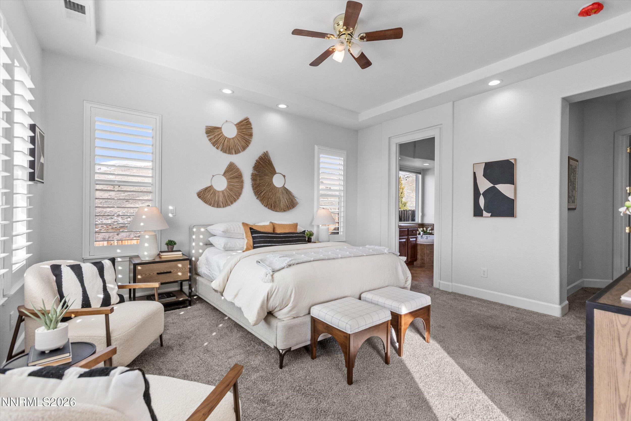5850 Geode Court Reno, NV 89523 - Photo 28 of 88 a bed room with a bed and a chandelier