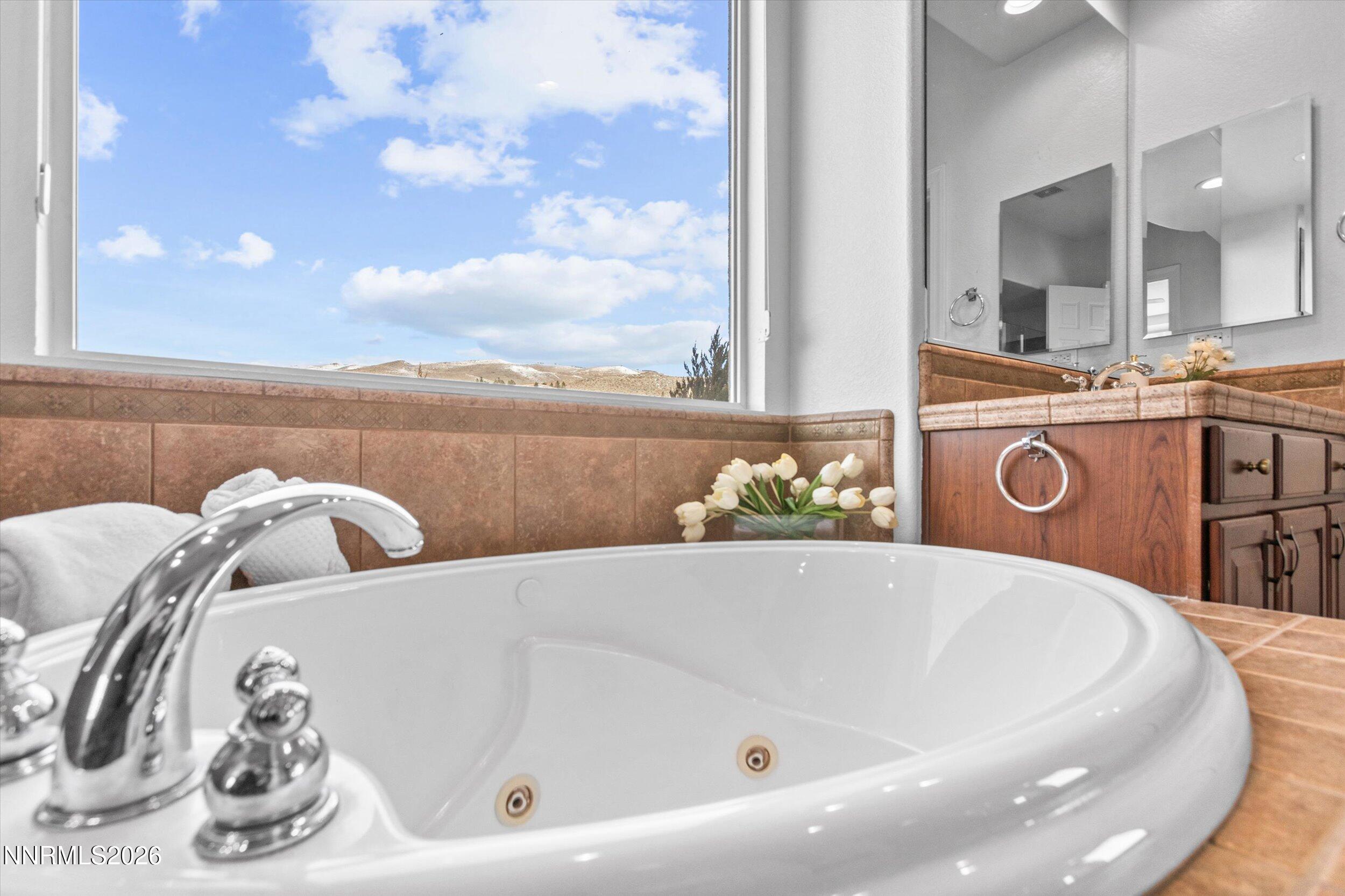 5850 Geode Court Reno, NV 89523 - Photo 30 of 88 a bath tub sitting next to a bathroom