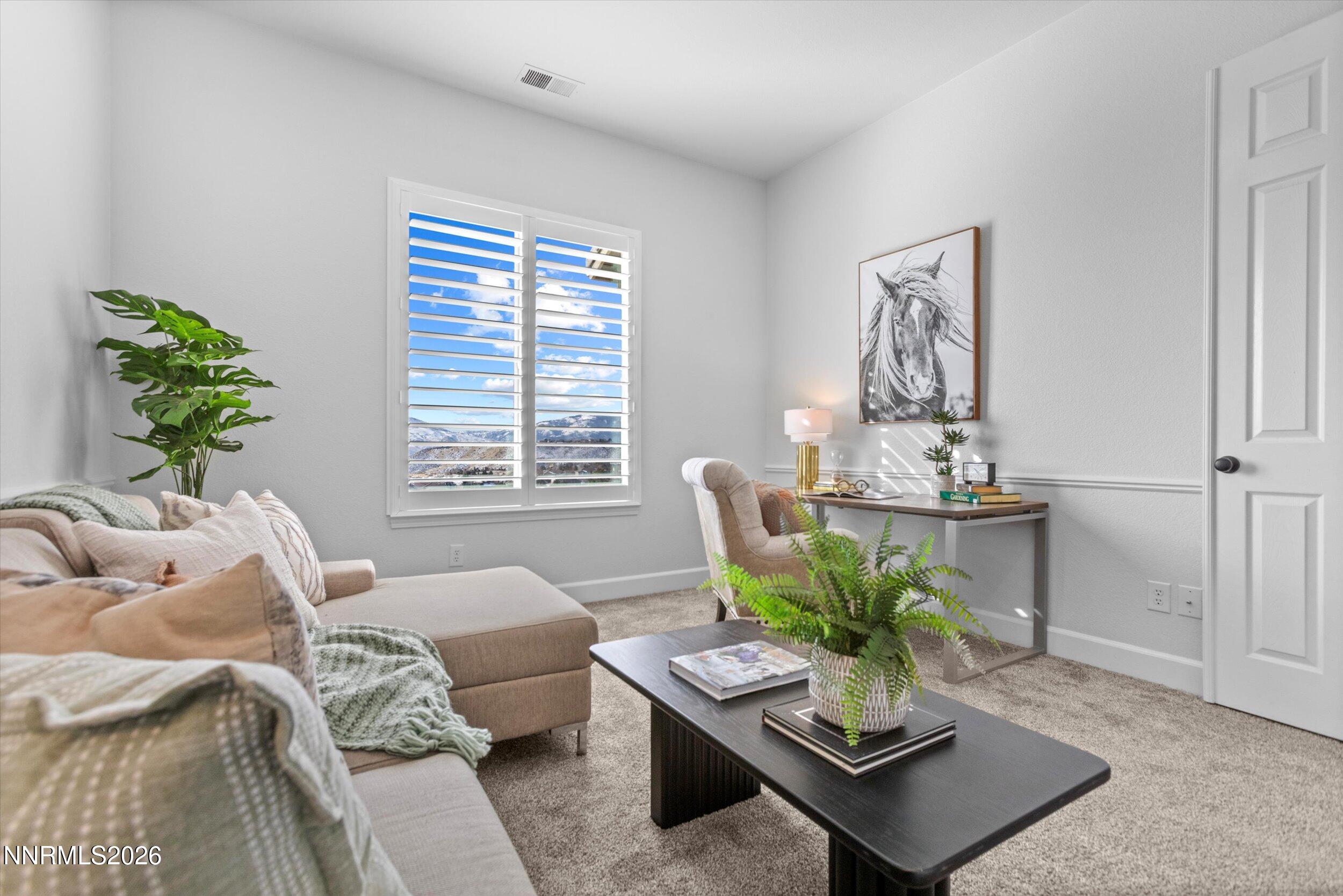 5850 Geode Court Reno, NV 89523 - Photo 38 of 88 a living room with furniture and a potted plant