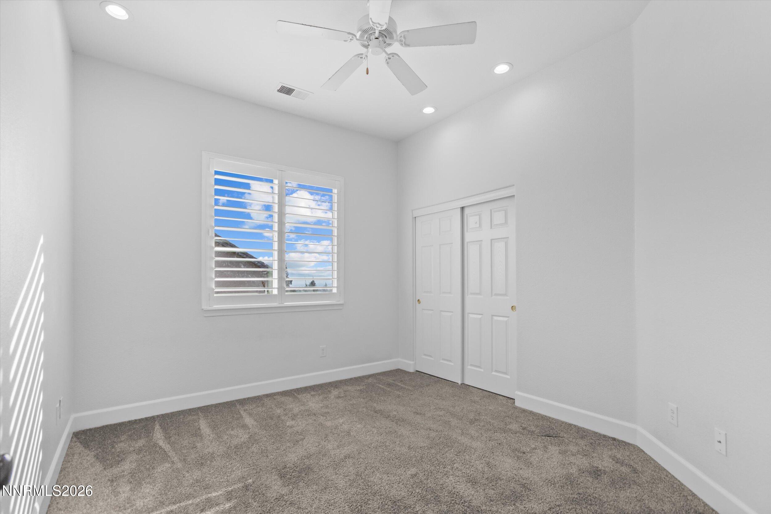5850 Geode Court Reno, NV 89523 - Photo 39 of 88 an empty room with windows and fan