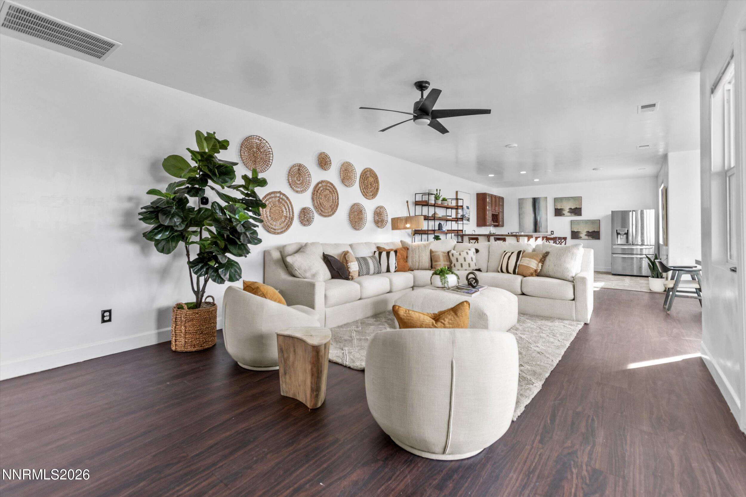 5850 Geode Court Reno, NV 89523 - Photo 42 of 88 a living room with furniture and a potted plant
