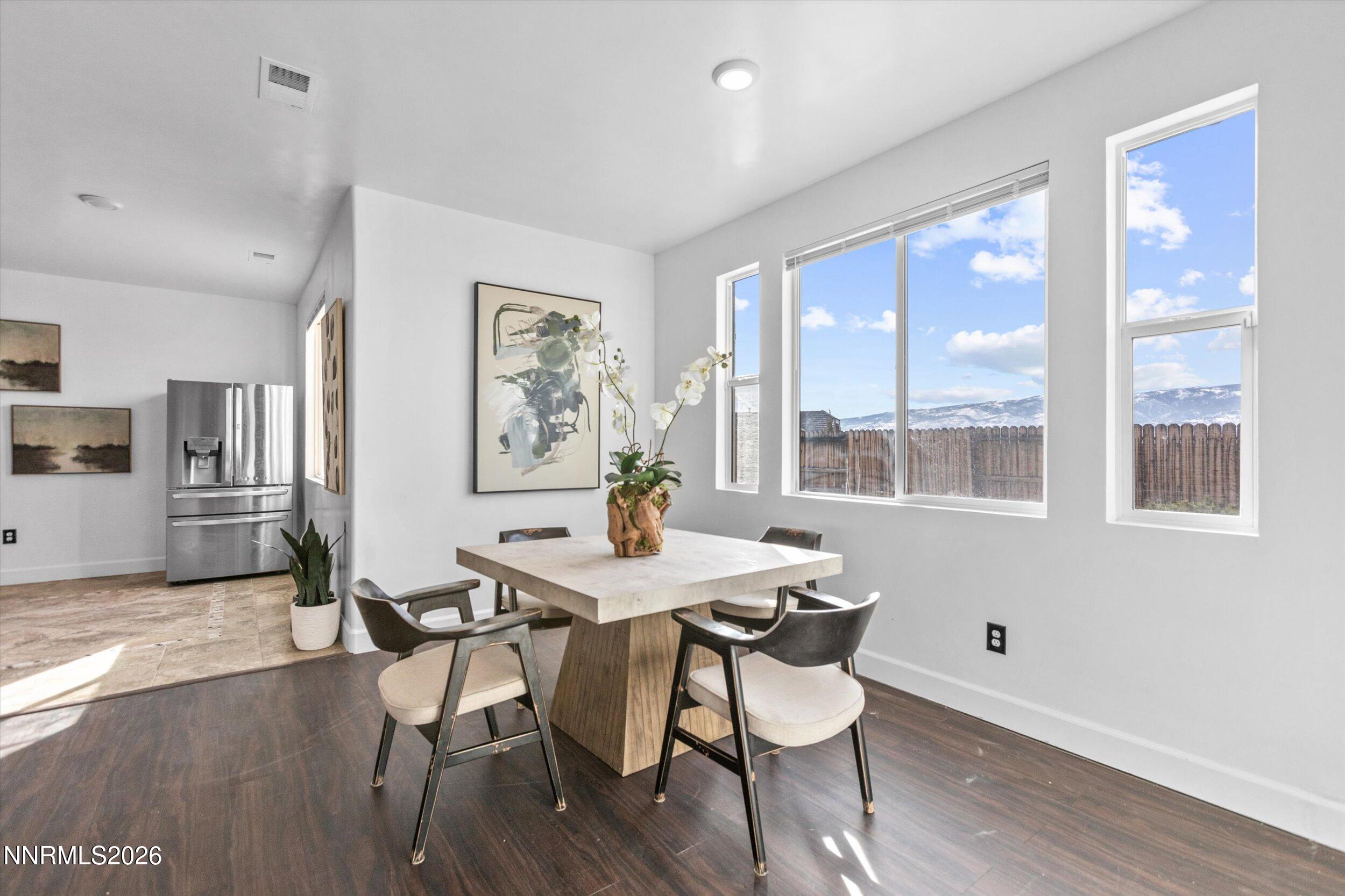 5850 Geode Court Reno, NV 89523 - Photo 46 of 88 a view of a dining room with furniture large window and wooden floor