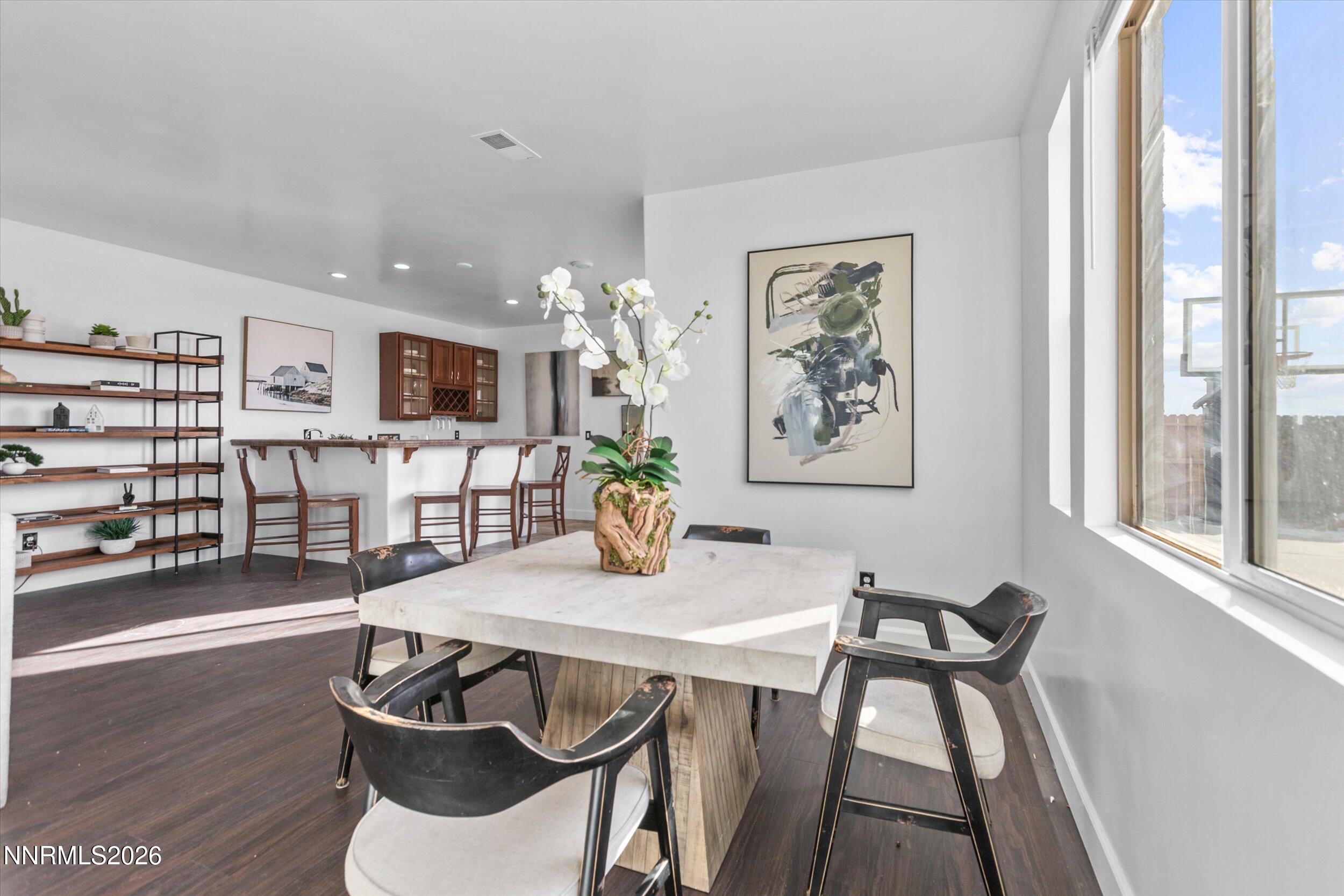 5850 Geode Court Reno, NV 89523 - Photo 47 of 88 a view of a dining room with furniture and wooden floor