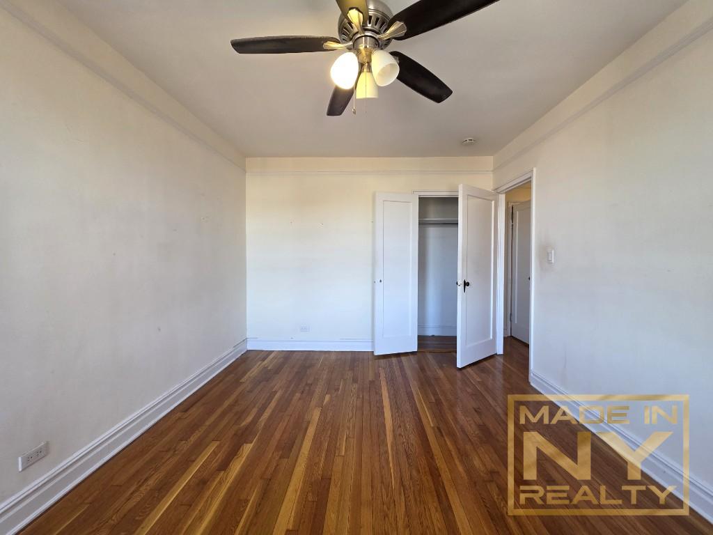 44-01 34th Avenue, Unit 4F Queens, NY 11101 - Photo 7 of 9 a view of empty room with wooden floor