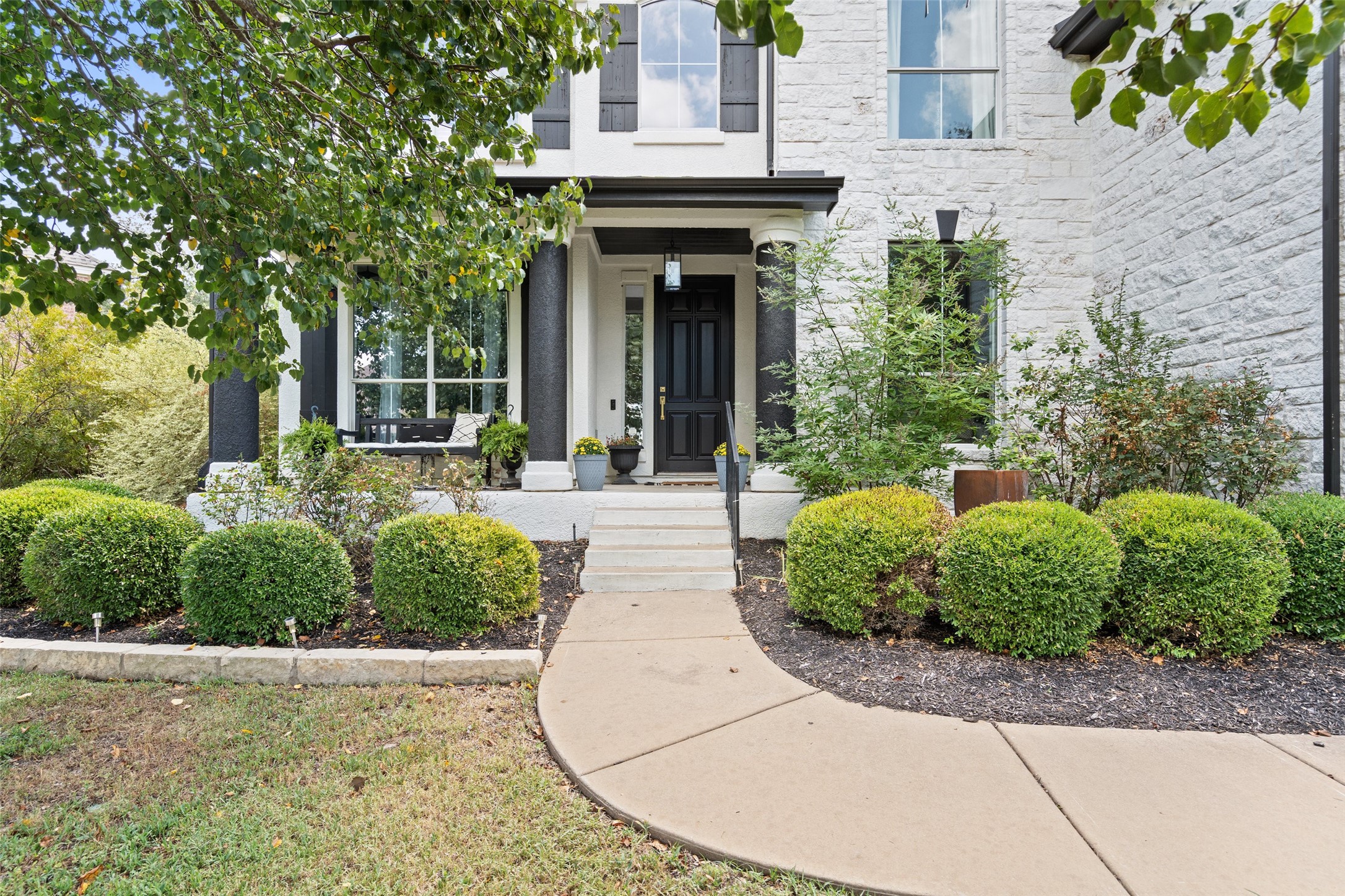 front view of a house with a yard