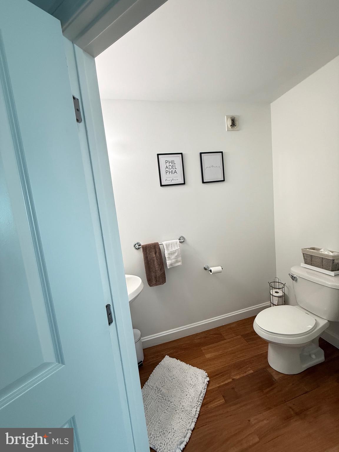 901 North Penn Street, Unit R2101 Philadelphia, PA 19123 - Photo 33 of 33 a bathroom with a toilet and a mirror