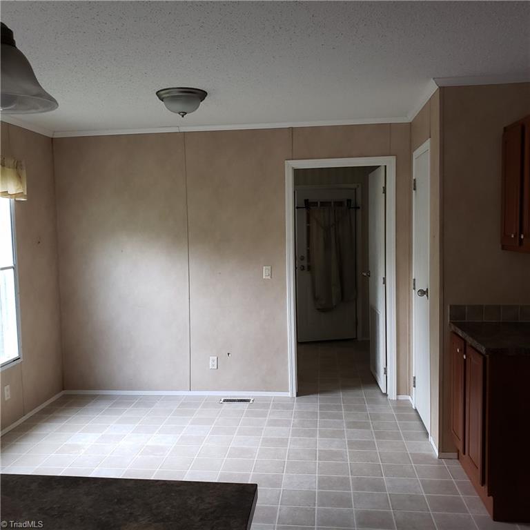 690 Cook Road Rural Hall, NC 27045 - Photo 14 of 30 Eat in kitchen is spacious and could easily fit a nice sized kitchen table & chairs!