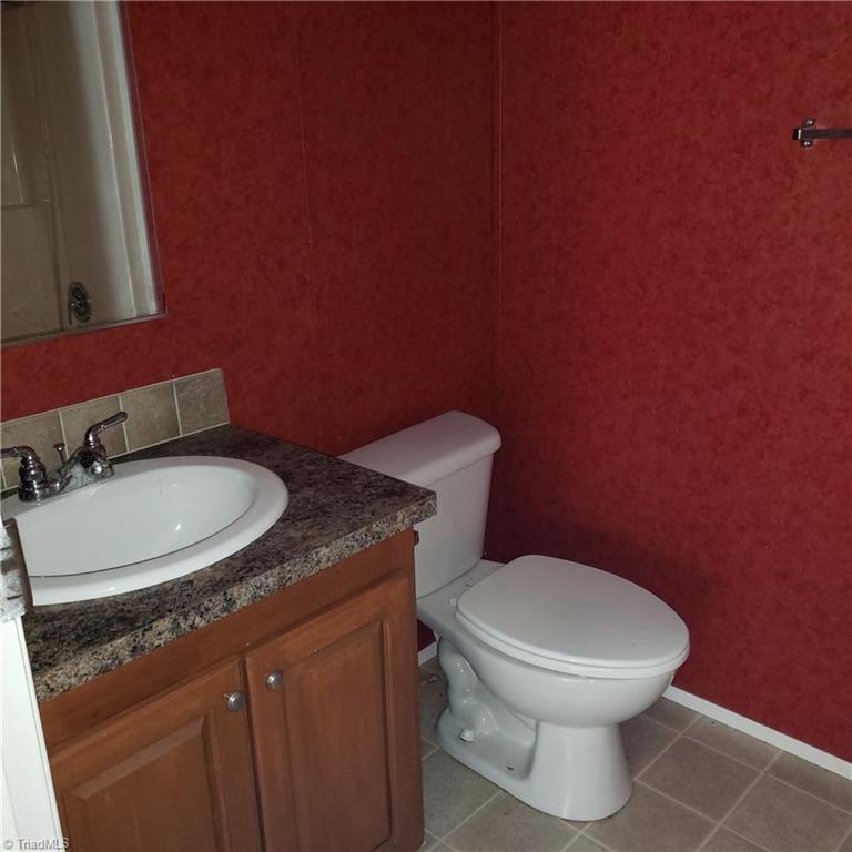 690 Cook Road Rural Hall, NC 27045 - Photo 23 of 30 2nd Bathroom is between the 2nd & 3rd bedrooms and has a tub/shower combo