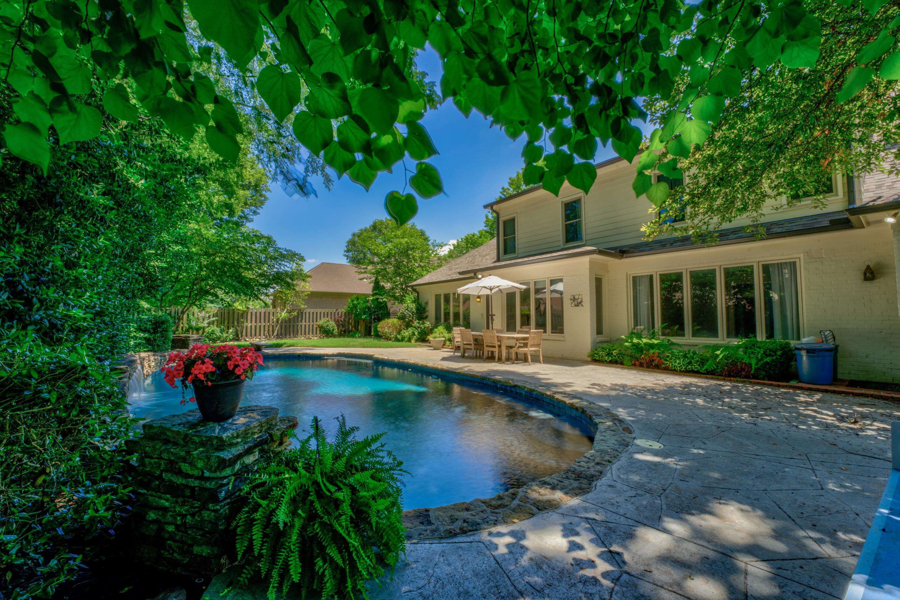 a swimming pool with outdoor view