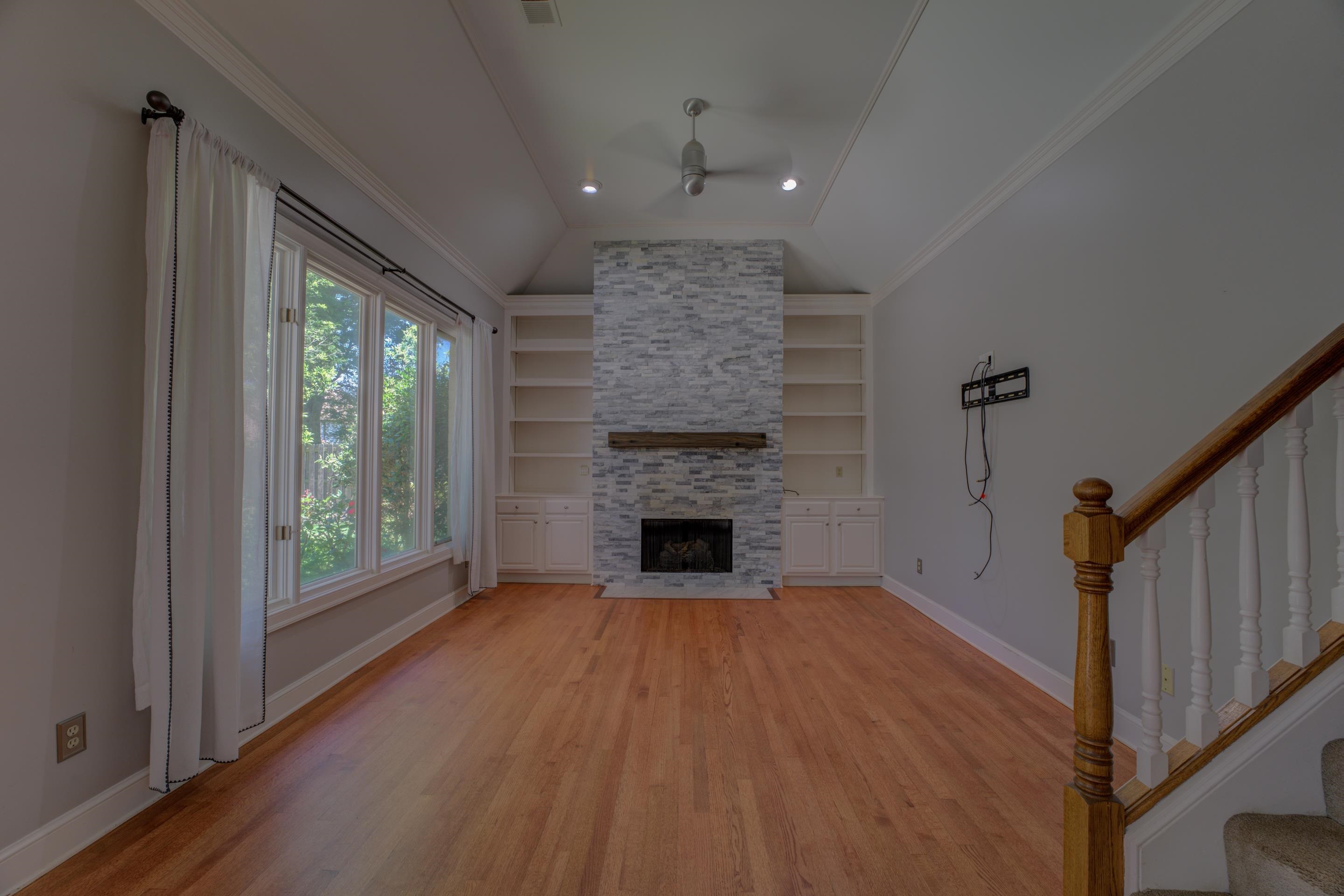 2142 Gallina Circle Collierville, TN 38017 - Photo 12 of 35 a view of a livingroom with a fireplace wooden floor and window