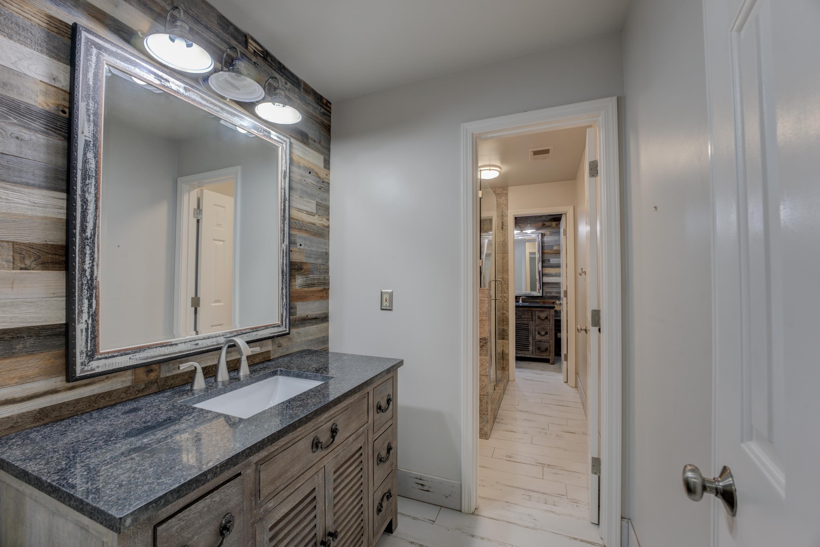 2142 Gallina Circle Collierville, TN 38017 - Photo 24 of 35 a bathroom with a granite countertop sink and a mirror