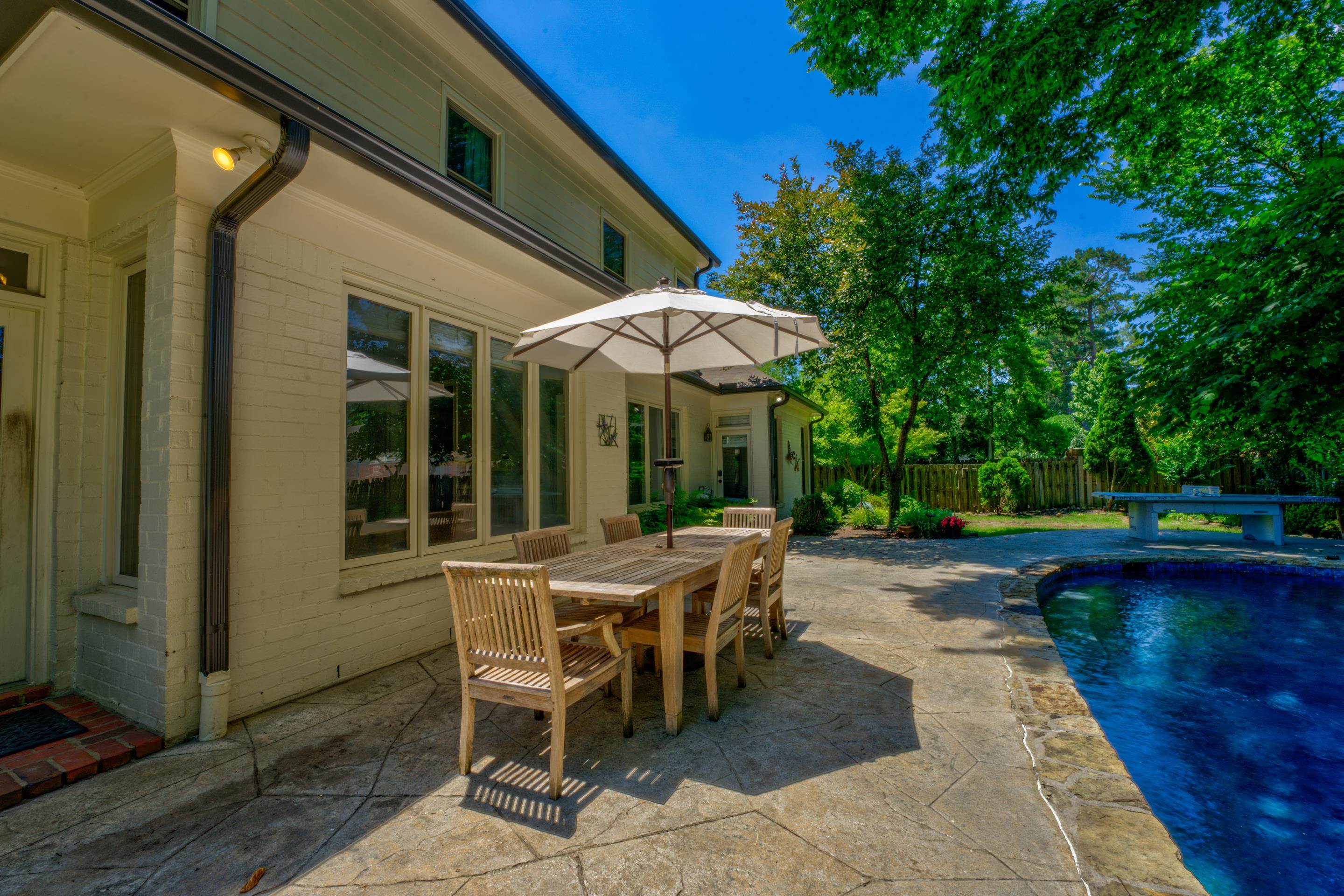 2142 Gallina Circle Collierville, TN 38017 - Photo 34 of 35 a view of a patio with a table and chairs under an umbrella