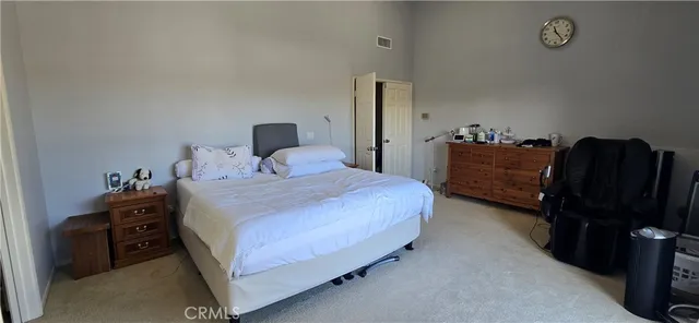 a bedroom with a bed and a closet