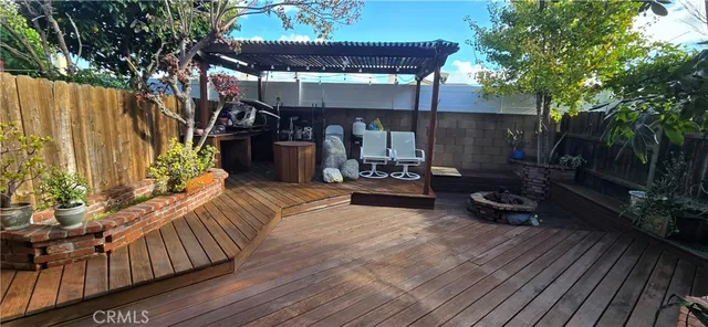 a view of a chairs and table in backyard