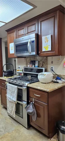 a kitchen with a stove and a sink