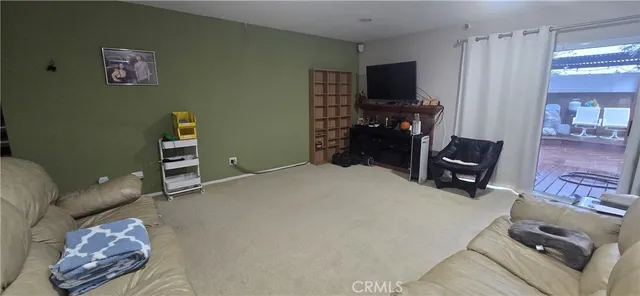 a bedroom with a bed and a chair