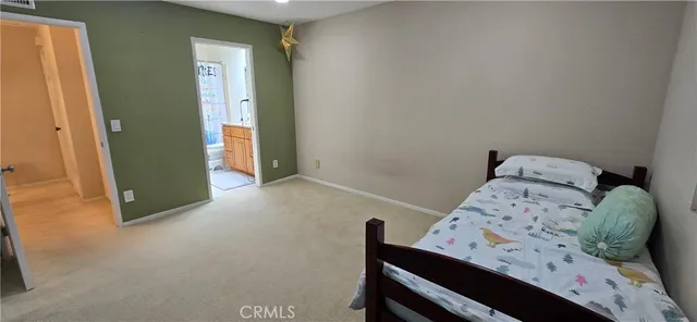 a view of a bedroom with a bed