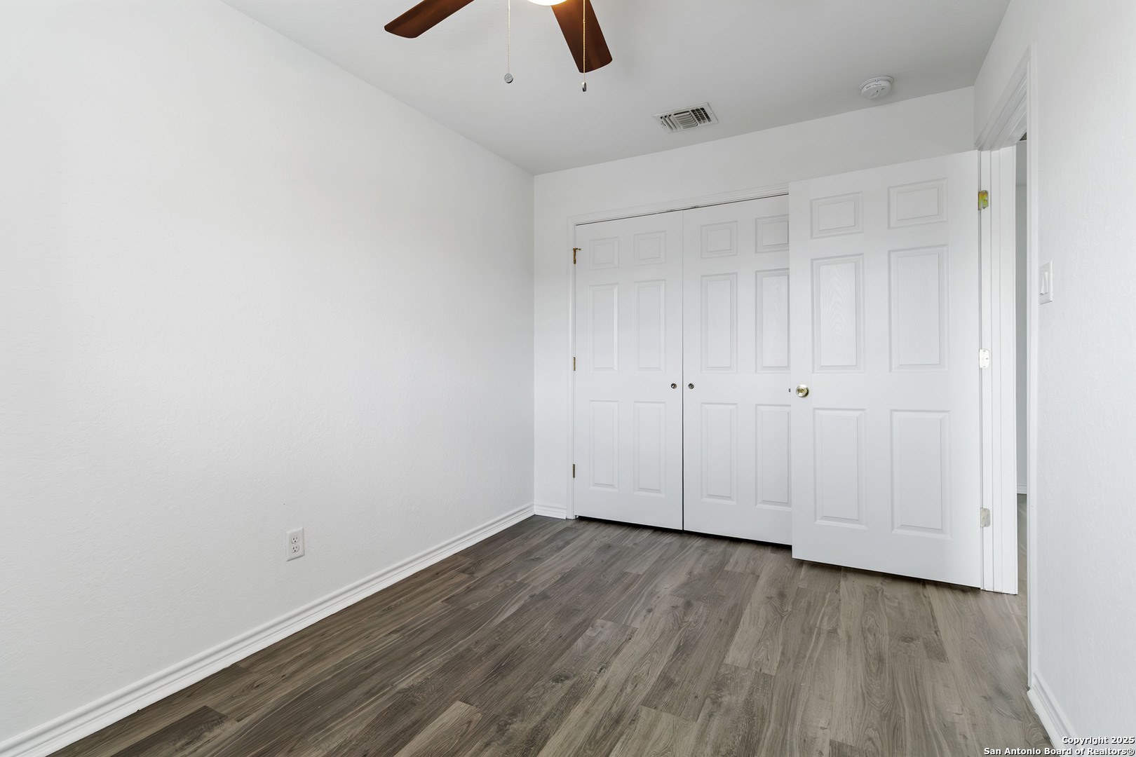 6942 Crestway Road San Antonio, TX 78239 - Photo 17 of 22 a view of room with hardwood floor
