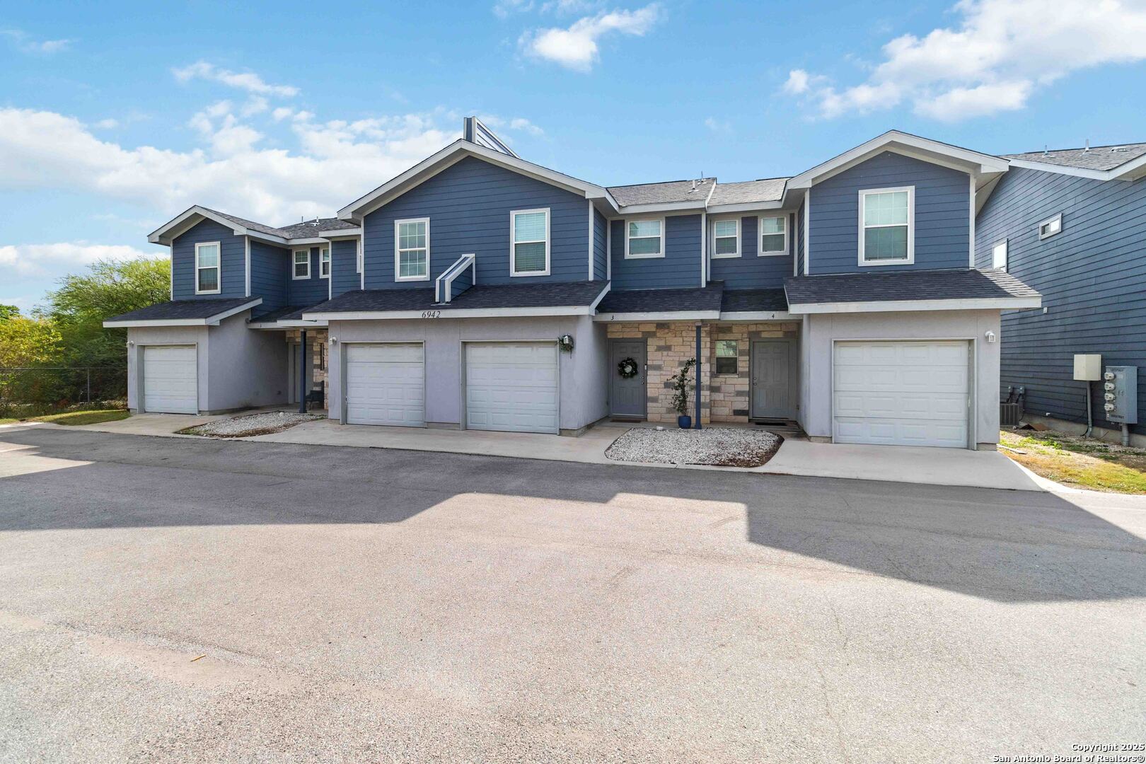 6942 Crestway Road San Antonio, TX 78239 - Photo 3 of 22 a front view of a house with a yard and garage