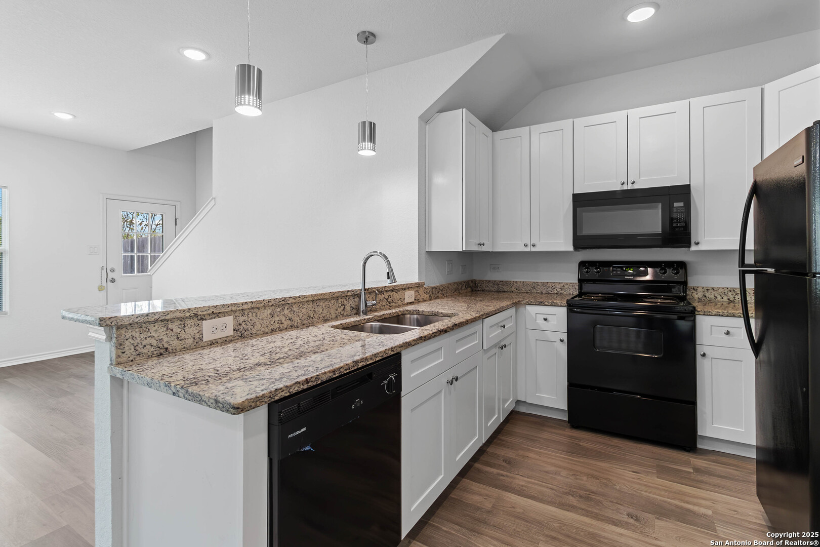 6942 Crestway Road San Antonio, TX 78239 - Photo 8 of 22 a kitchen with a sink stove and refrigerator